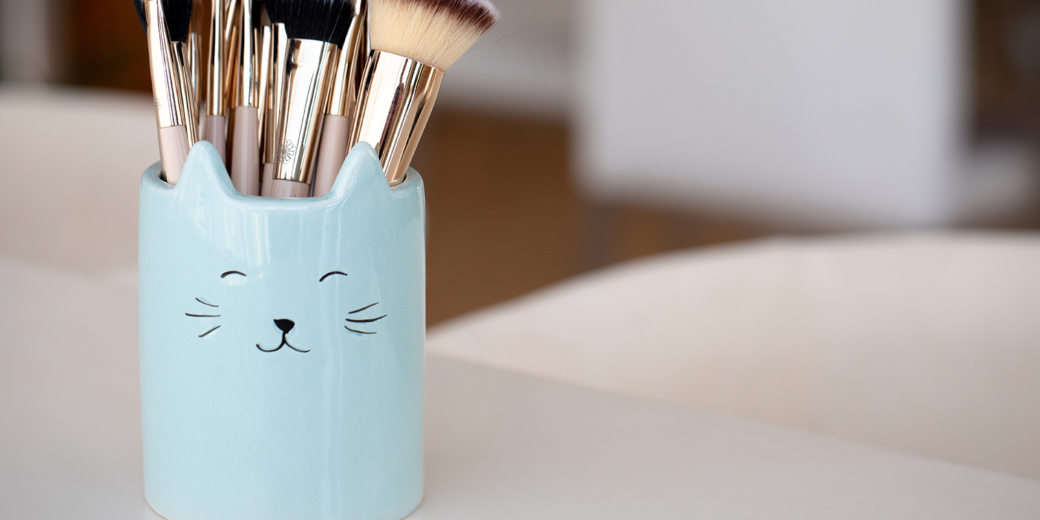 Brushes in a happy mug